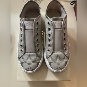 Coach women’s Silver Slip-On Sneakers